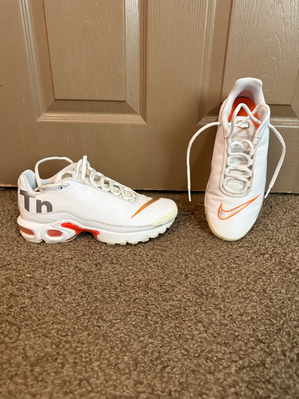 Nike White Trainers with Orange Swoosh Accents